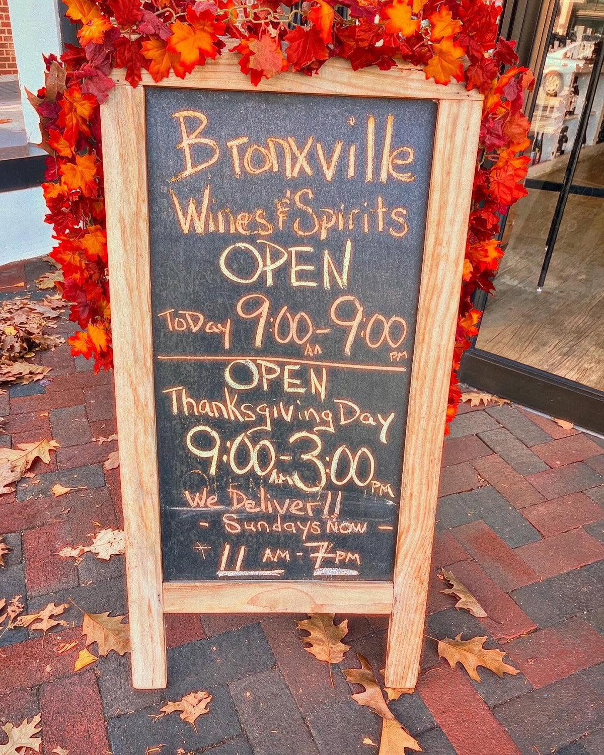 Chalkboard sign for same-day wine delivery from Bronxville Wines & Spirits